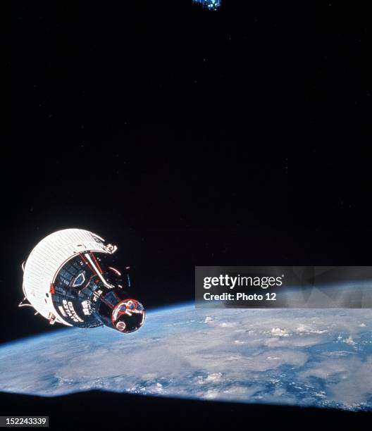 Gemini 7 spacecraft photographed from the hatch window of Gemini 6 spacecraft .