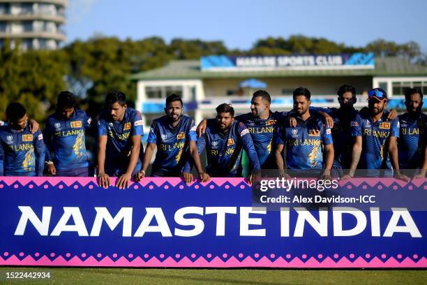 Players of Sri Lanka prepare to pose for a photograph behind the Namaste India winners board as they celebrate after qualifying for the ICC Men’s...