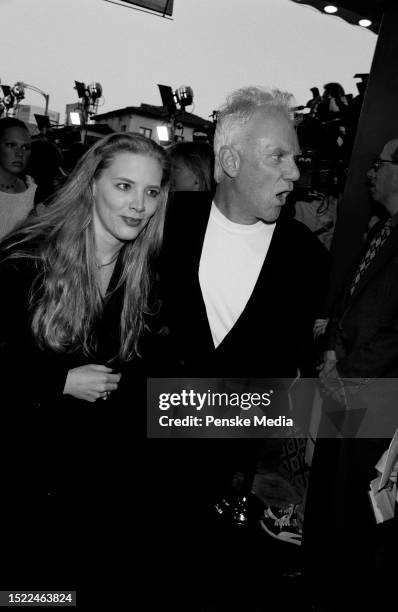 Kelley Kuhr and Malcolm McDowell attend the local premiere of "Twister" at the Mann Village Theatre in the Westwood neighborhood of Los Angeles,...