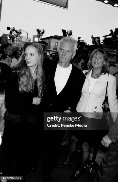 Kelley Kuhr, Malcolm McDowell, and guest attend the local premiere of "Twister" at the Mann Village Theatre in the Westwood neighborhood of Los...