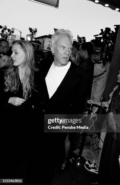 Kelley Kuhr and Malcolm McDowell attend the local premiere of "Twister" at the Mann Village Theatre in the Westwood neighborhood of Los Angeles,...