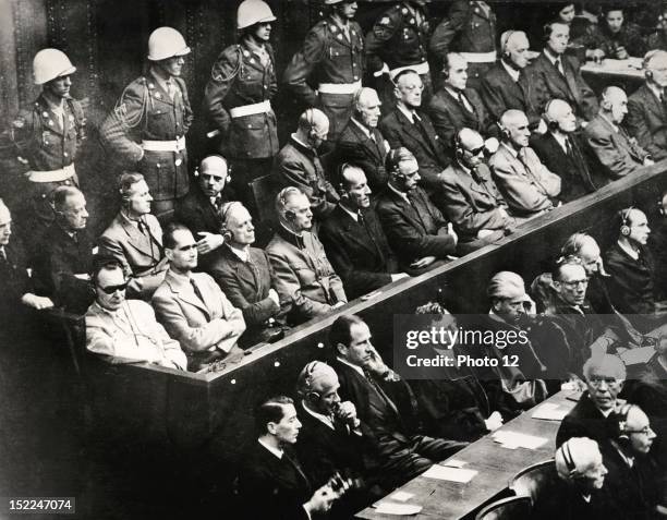 Nuremberg trial , , The 21 accused, during the reading of the charges against them, , 1st rank, l, to r, , , Goring, Hess, Ribbentrop, Keitel,...