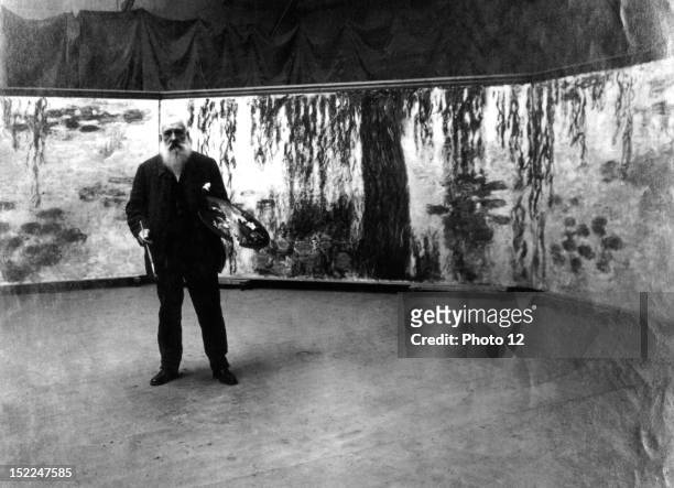Painter Claude Monet in front of his 'Waterlilies' paintings, Private collection.
