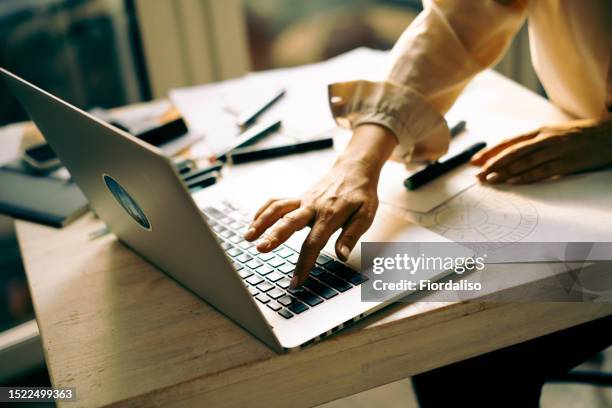 portrait of a woman with laptop - working on laptop in train top view stock pictures, royalty-free photos & images