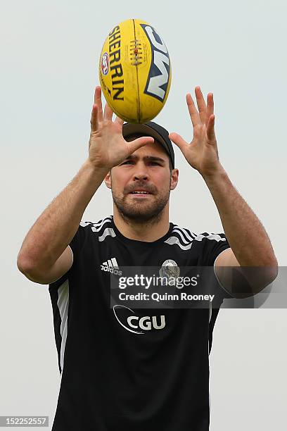 Chris Dawes of the Magpies marks during a Collingwod Magpies AFL recovery sessionat the St Kilda Sea Baths on September 18, 2012 in Melbourne,...