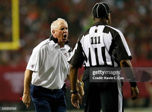 Head Coach John Fox of the Denver Broncos yells at back judge Terrence Miles during their game against the Atlanta Falcons at the Georgia Dome on...