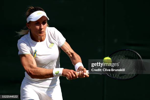 Lesia Tsurenko of Ukraine plays a backhand against Ana Bogdan of Romania in the Women's Singles third round match during day five of The...