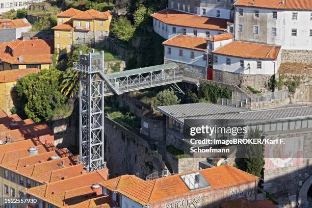 view of lift ascensor da ribeira, elevador da lada, historic old town, porto, portugal - ascensore stock pictures, royalty-free photos & images