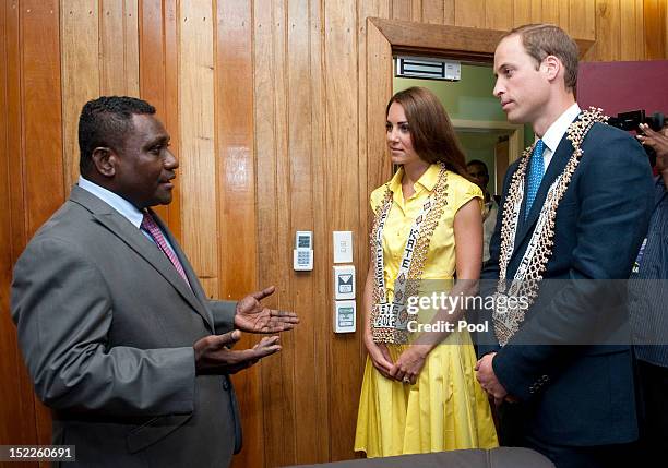 Catherine, Duchess of Cambridge and Prince William, Duke of Cambridge are seen wearing personalised necklaces given to them as they visit the Prime...