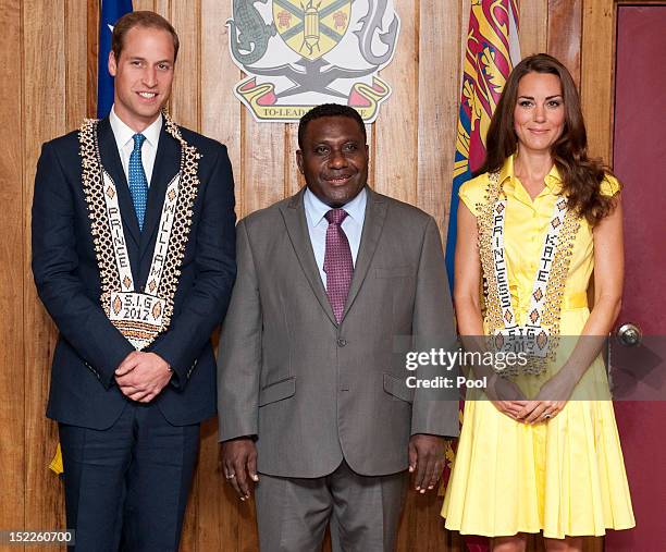 Catherine, Duchess of Cambridge and Prince William, Duke of Cambridge are seen wearing personalised necklaces given to them as they visit the Prime...