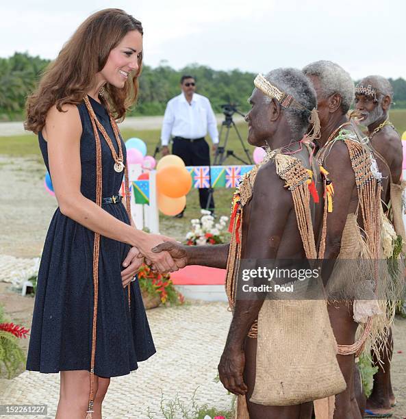 Catherine, Duchess of Cambridge meets a local as she arrives in Marau on their way to Tivanipupu on day 7 of their Diamond Jubilee Tour, on September...
