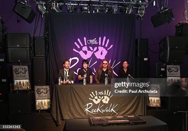 Musicians Sergio Vallin, Alex Gonzalez, Fher Olvera and Juan Calleros of the rock band Mana get inducted into Guitar Center's RockWalk at Guitar...