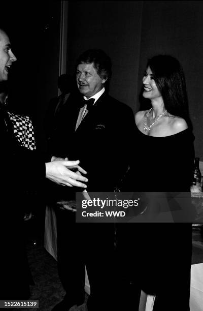 Prince Edward , Charles Bronson, and Kim Weeks attend an event at the Beverly Hilton Hotel in Beverly Hills, California, on December 10, 1993.