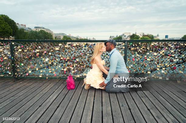 young couple kissing - love lock stock pictures, royalty-free photos & images