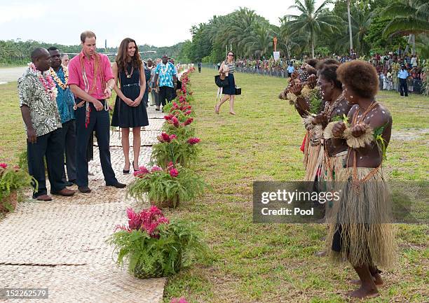 Prince William, Duke of Cambridge and Catherine, Duchess of Cambridge meet locals in Honiara on their way to Tivanipupu on day 7 of their Diamond...