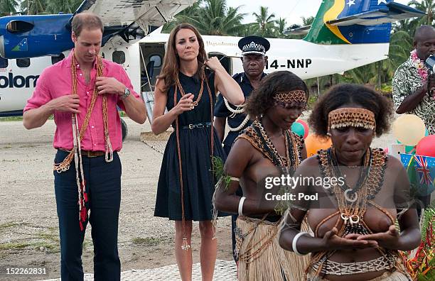 Prince William, Duke of Cambridge and Catherine, Duchess of Cambridge are seen after being presented with garlands as they arrive in Honiara on their...