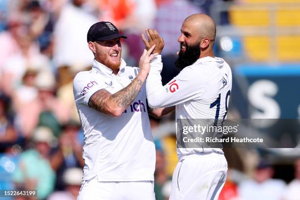 Moeen Ali of England with captain Ben Stokes celebrates dismissing Steve Smith of Australia during Day Two of the LV= Insurance Ashes 3rd Test Match...