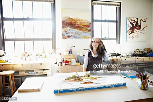 Portrait of female artist standing in studio