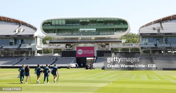 England players cross the pitch to attend a nets session prior to the Women's Ashes 3rd Vitality IT20 match between England and Australia at Lord's...