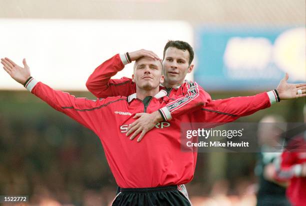 David Beckham of Manchester United is congratulated by teammate Ryan Giggs after scoring during the FA Carling Premiership match against Leicester...