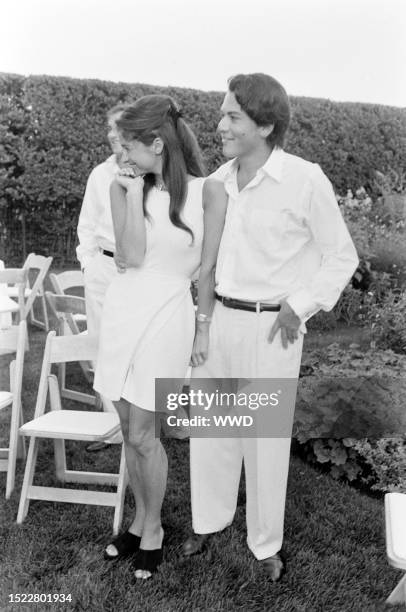 Elizabeth Guber and David Schulhof attend an event at the Schulof residence in East Hampton, New York, on August 9, 1993.