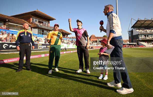 Lewis Gregory of Somerset flips the coin as Steven Mullaney of Notts Outlaws looks on ahead of the Vitality Blast T20 Quarter-Final match between...