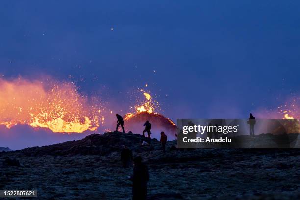 People visit the eruption site after a volcano has erupted on the Reykjanes peninsula near Reykjavik, Iceland on July 11, 2023. In southwest Iceland,...