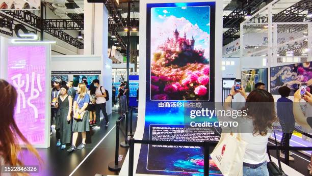 Visitors experience the art of AI painting generation at SenseTime Exhibition area at the 2023 World Artificial Intelligence Conference in Shanghai,...