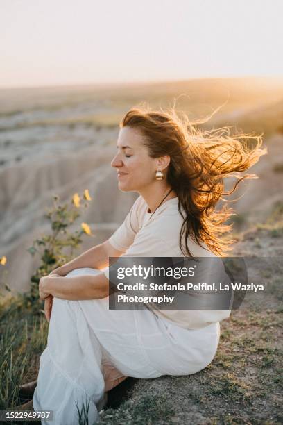 side view of happy woman with eyes closed at sunset - beautiful woman sun stock pictures, royalty-free photos & images