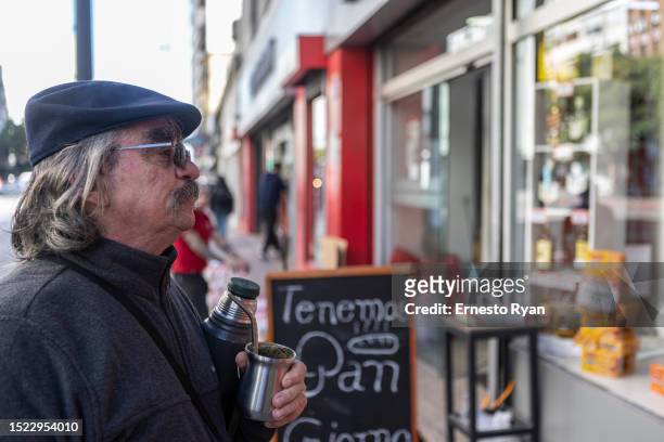 Man drinks mate using bottled water due to the high salinity from tap water on July 07, 2023 in Canelones, Uruguay. The country faces its worst...