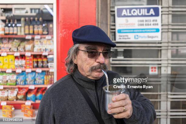 Man drinks mate using bottled water due to the high salinity from tap water on July 07, 2023 in Montevideo, Uruguay. The country faces its worst...