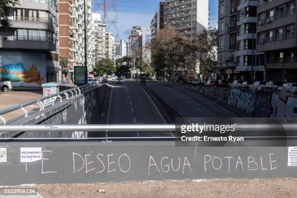 Graffiti reads 'I wish you drinking water' amid the increase in salinity of the tap water on July 07, 2023 in Montevideo, Uruguay. The country faces...