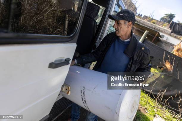 Man loads a water heater to his van after its repair as a demand in their repairs surges due to the high salinity in the tap water which causes...