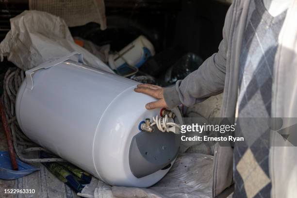 Detail of a water heater at a repair shop as a demand in their repairs surges due to the high salinity in the tap water which causes damages to the...