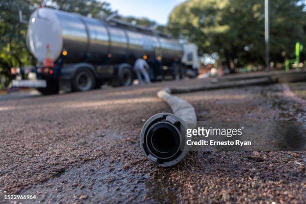 Detail of a tank truck hOSE that is connected to a water bomb which pumped underground water that is drinkable to supply hospitals on July 07, 2023...