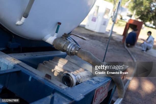 Detail of a tank truck that is connected to a water bomb which pumped underground water that is drinkable to supply hospitals on July 07, 2023 in...