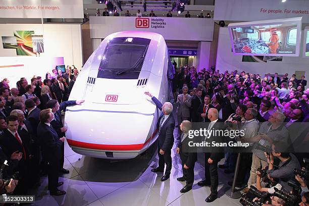 German Transport Minister Peter Ramsauer and Deutsche Bahn head Ruediger Grube unveil a mockup of the ICx, the latest generation of Deutsche Bahn...