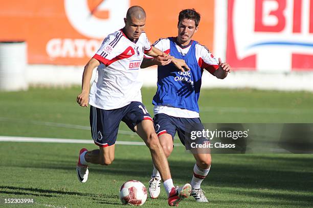 Jorge Enriquez and Antonio Gallardo fight for the ball during a training session of Chivas at Club Verde Valle on September 17, 2012 in Zapopan,...