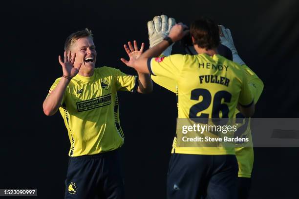 Nathan Ellis of Hampshire Hawks celebrates with his team mates after taking the wicket of Pat Brown of Worcestershire Rapids during the Vitality...
