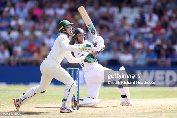 Ben Stokes of England hits a six as Australia wicketkeeper Alex Carey looks on during Day Two of the LV= Insurance Ashes 3rd Test Match between...