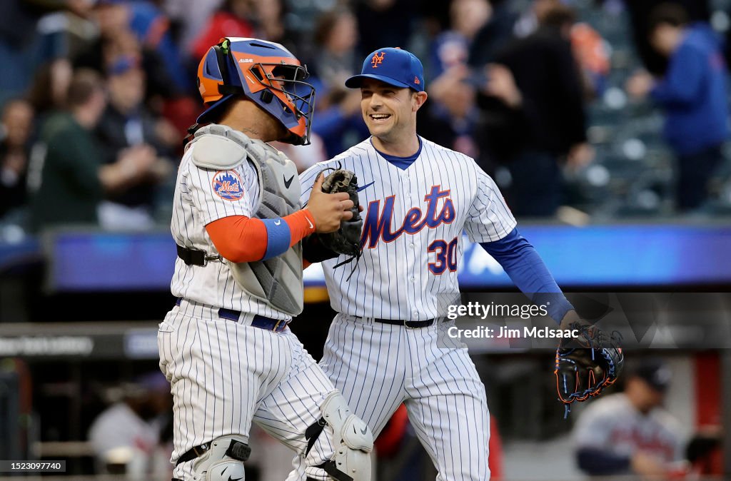 Mets Rattle David Robertson and Francisco Alvarez of the New York Mets in action ...