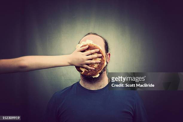 pie on face - scott macbride stock pictures, royalty-free photos & images