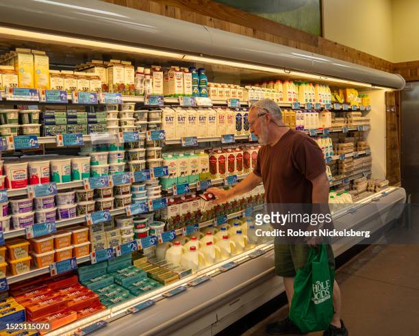 Man shops for milk July 6 2023 at the Trader Joe's supermarket in South Burlington, Vermont.