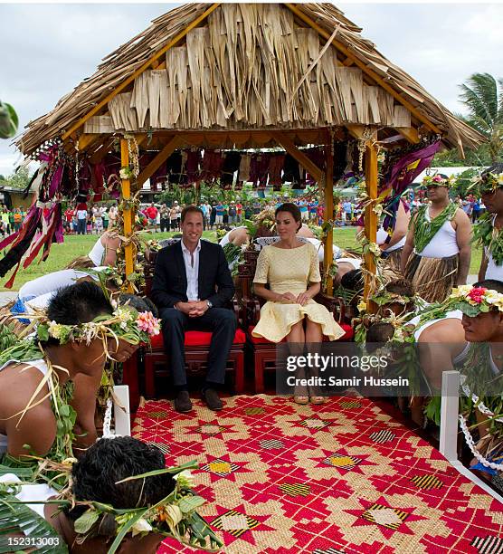 Catherine, Duchess of Cambridge and Prince William, Duke of Cambridge are carried to a welcoming ceremony when they arrive at Funafuti airport during...