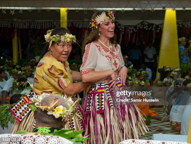 Catherine, Duchess of Cambridge prepares to dance with traditional dancers at the Vaiku Falekaupule for an entertainment programme during the Royal...