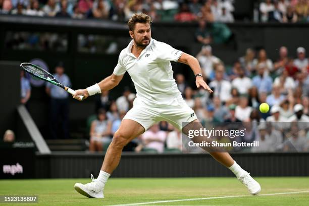 Stan Wawrinka of Switzerland plays a forehand against Novak Djokovic of Serbia in the Men's Singles third round match during day five of The...