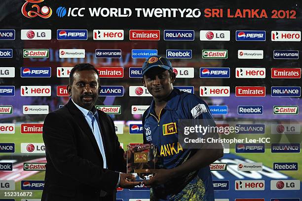 Minister of Sport Mahindananda Aluth Gamage presents Ajantha Mendis of Sri Lanka with his Player of the Match award Maduring the ICC World Twenty20...