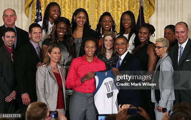 President Barack Obama poses for a picture with the WNBA champion Minnesota Lynx, during an event to honor the champions at the White House on...