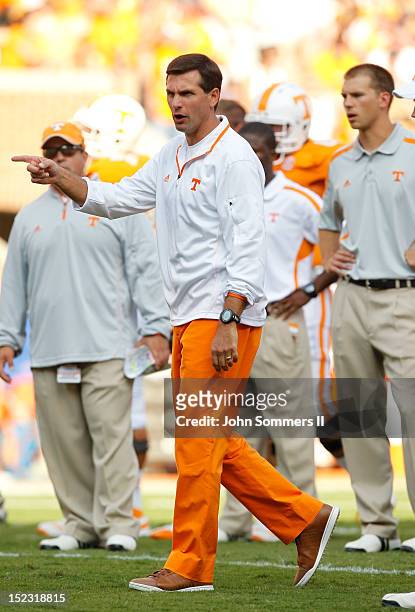 Derek Dooley head coach of the Tennessee Volunteers during pregame warm-ups before their game against the Florida Gators at Neyland Stadium on...