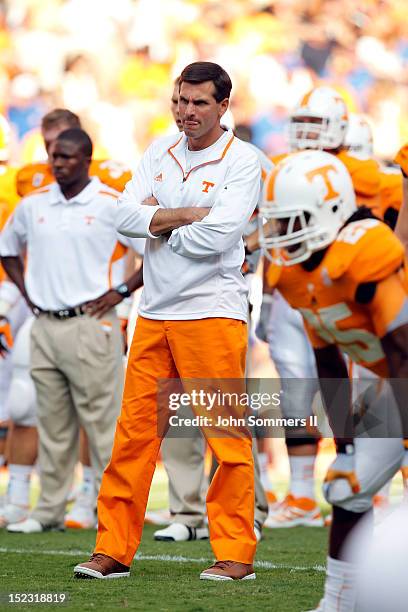 Derek Dooley head coach of the Tennessee Volunteers during pregame warm-ups before their game against the Florida Gators at Neyland Stadium on...